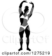Clipart Of A Silhouetted Black And White Stretching Female Bodybuilder 2 Royalty Free Vector Illustration