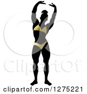 Clipart Of A Silhouetted Stretching Female Bodybuilder In A Gold Suit Royalty Free Vector Illustration