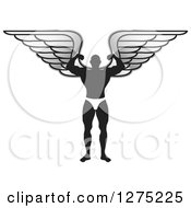 Clipart Of A Silhouetted Male Bodybuilder Angel Flexing Royalty Free Vector Illustration by Lal Perera