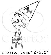 Cartoon Clipart Of A Black And White Happy Smart Boy Wearing An Anti Dunce Hat And Sitting On A Stool Royalty Free Vector Line Art Illustration