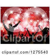 Poster, Art Print Of Silhouetted Group Of People Dancing At A Christmas Party Over Red With Snowflakes And Sparkles Under Merry Christmas And A Happy New Year Text