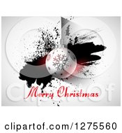 Clipart Of A Merry Christmas Greeting Under A Suspended Bauble And Grunge Splatter Royalty Free Vector Illustration