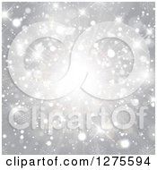 Clipart Of A Silver Christmas Star And Light Burst With Snowflakes Royalty Free Vector Illustration