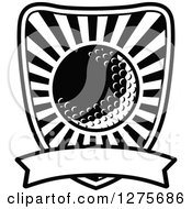 Clipart Of A Black And White Golf Ball And Rays Shield And Banner Royalty Free Vector Illustration