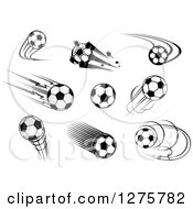 Clipart Of Black And White And Grayscale Flying Soccer Balls Royalty Free Vector Illustration