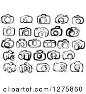 Clipart Of A Black And White Cameras 3 Royalty Free Vector Illustration