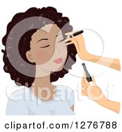 White Womans Hands Applying Eyeliner On A Black Models Face