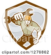 Poster, Art Print Of Retro Mechanic Man Running And Holding A Giant Spanner Wrench In A Brown White And Gray Shield