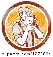 Clipart Of A Retro Male Camera Man Filming In A Tan Brown White And Orange Ray Circle Royalty Free Vector Illustration by patrimonio
