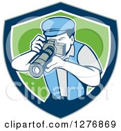 Clipart Of A Retro Male Photographer Taking Pictures In A Gray Blue White And Green Shield Royalty Free Vector Illustration