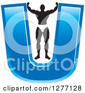 Poster, Art Print Of Flexing Black And White Male Bodybuilder Stretching Out A Blue Letter U