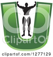 Poster, Art Print Of Flexing Black And White Male Bodybuilder Stretching Out A Green Letter U