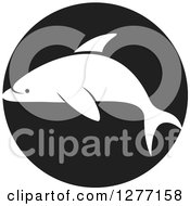 Poster, Art Print Of White Silhouetted Dolphin Over A Black Circle
