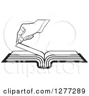 Black And White Hand Turning A Book Page