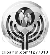 Clipart Of A Round Silver Icon Of A Family Holding Hands Over Abstract Wings Royalty Free Vector Illustration by Lal Perera