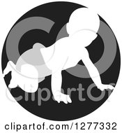 Clipart Of A White Silhouetted Baby Crawling In A Gray Diaper In A Black Circle Royalty Free Vector Illustration by Lal Perera