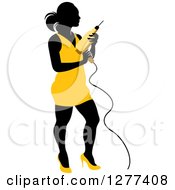 Poster, Art Print Of Black Silhouetted Woman In A Yellow Dress Holding A Power Drill