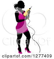 Poster, Art Print Of Black Silhouetted Woman In A Pink Dress Holding A Power Drill