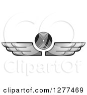 Clipart Of A Black And White Circle With Silver Wings Royalty Free Vector Illustration