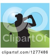 Poster, Art Print Of Black Silhouetted Male Golfer Swinging Over Hills And Blue Sky