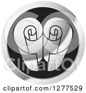 Clipart Of A Black And Silver Round Srcoll Icon Royalty Free Vector Illustration