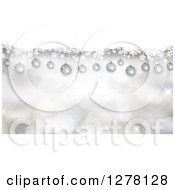 Clipart Of Suspended 3d Christmas Baubles And Snowflakes Over Bokeh Royalty Free Vector Illustration