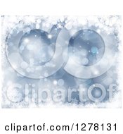 Clipart Of A Christmas Background Of Blue Bokeh Flares And Snowflakes Royalty Free Illustration