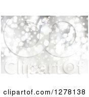 Clipart Of A Christmas Background Of Bokeh Flares And Snowflakes 2 Royalty Free Illustration
