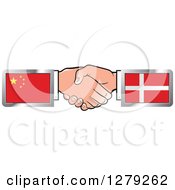 Caucasian Hands Shaking With Chinese And Denmark Flags