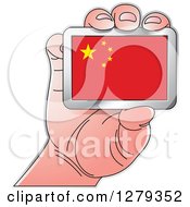 Caucasian Hand Holding A Chinese Flag