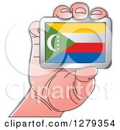 Clipart Of A Caucasian Hand Holding A Comorian Flag Royalty Free Vector Illustration
