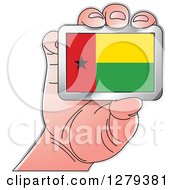 Poster, Art Print Of Caucasian Hand Holding A Guinea Bissau Flag