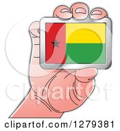 Clipart Of A Caucasian Hand Holding A Guinea Bissau Flag Royalty Free Vector Illustration