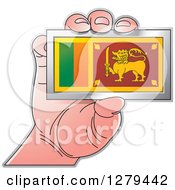 Caucasian Hand Holding A Sri Lanka Flag