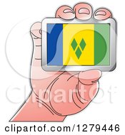 Clipart Of A Caucasian Hand Holding A St Vincent And Grenadines Flag Royalty Free Vector Illustration