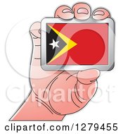 Clipart Of A Caucasian Hand Holding A Timor Flag Royalty Free Vector Illustration