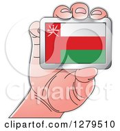 Poster, Art Print Of Caucasian Hand Holding An Oman Flag