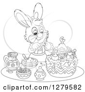 Poster, Art Print Of Black And White Cute Female Bunny Rabbit Decorating A Christmas Cake
