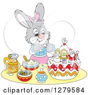 Poster, Art Print Of Cute Gray Girl Bunny Rabbit Decorating A Christmas Cake