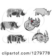 Clipart Of Gray Sketched And Tribal Rhinos Royalty Free Vector Illustration