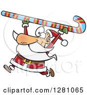 Happy Santa Clause Carrying A Giant Christmas Candy Cane Over His Head