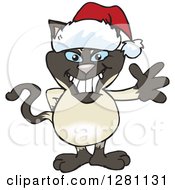 Clipart Of A Friendly Waving Siamese Cat Wearing A Christmas Santa Hat Royalty Free Vector Illustration