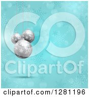 3d Silver Christmas Baubles Suspended Over Blue Snowflakes And Bokeh Flares