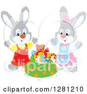 Clipart Of Cute Gray Festive Rabbits By A Christmas Sack Royalty Free Vector Illustration