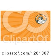 Clipart Of A Retro Falcon And Orange Rays Background Or Business Card Design Royalty Free Illustration