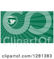 Clipart Of A Retro Elephant And Green Rays Background Or Business Card Design Royalty Free Illustration