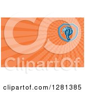 Clipart Of A Retro Woodcut Cobra And Orange Rays Background Or Business Card Design Royalty Free Illustration