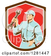 Poster, Art Print Of Retro Male Mechanic Holding A Wrench In A Brown White And Red Shield