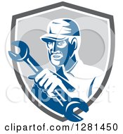 Poster, Art Print Of Retro Male Mechanic Holding Out A Wrench In A Gray Blue And White Shield