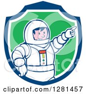 Poster, Art Print Of Cartoon Male Astronaut Pointing In A Blue White And Green Shield